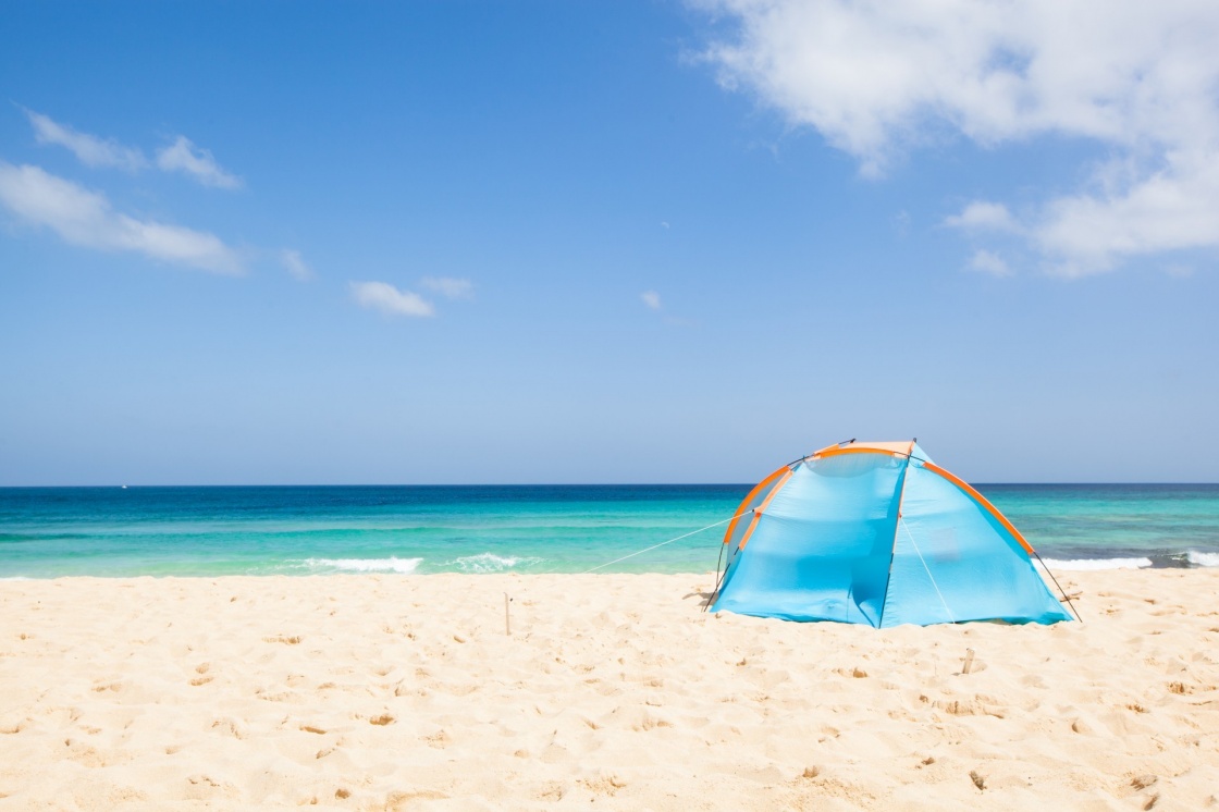 'camping with a tent at a lonesome beach with a turquoise sea and blue sky in the background, Fuerteventura, Canary Islands, Spain, Europe' - Kanariansaaret